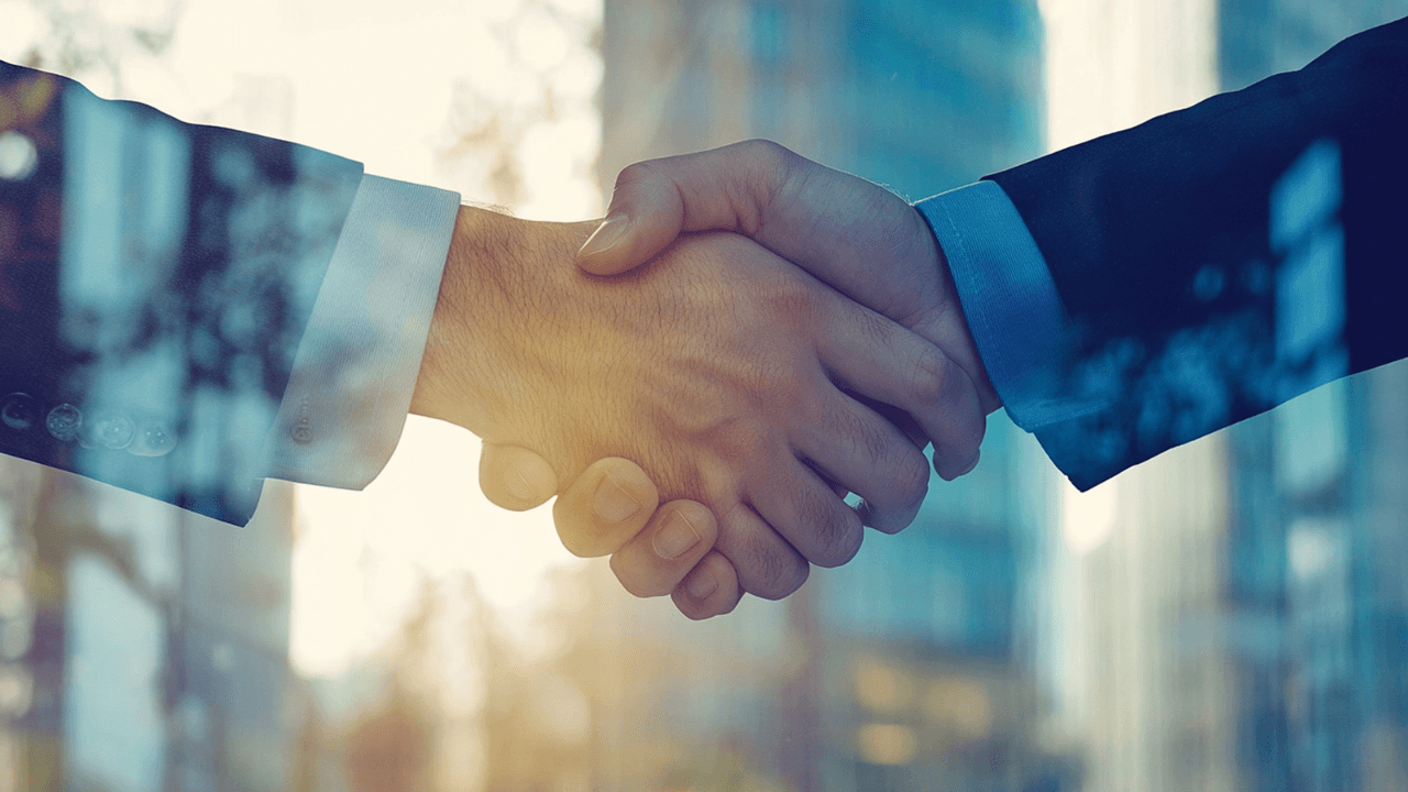 photo of two business man hand shaking office background. Image Credit: Adobe Stock Images/Syed Qaseem Raza