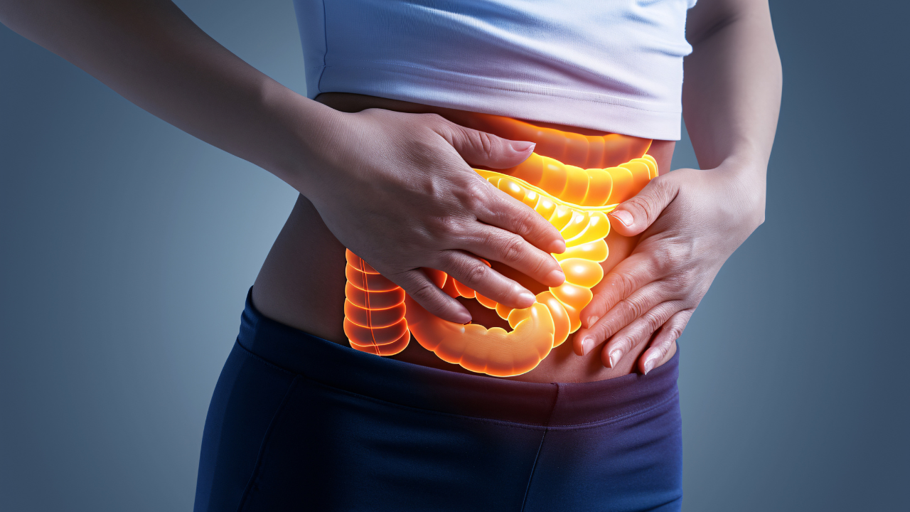 Gastrointestinal complaints concept, a woman holding her stomach, hologram intestines depicting abdominal pain or discomfort. Image Credit: Adobe Stock Images/Dennis