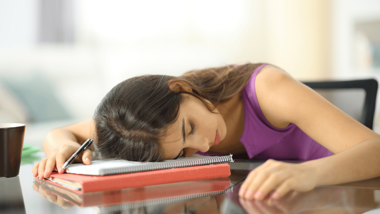 Tired overworked student sleeping at home. Image Credit: Adobe Stock Images/PheelingsMedia