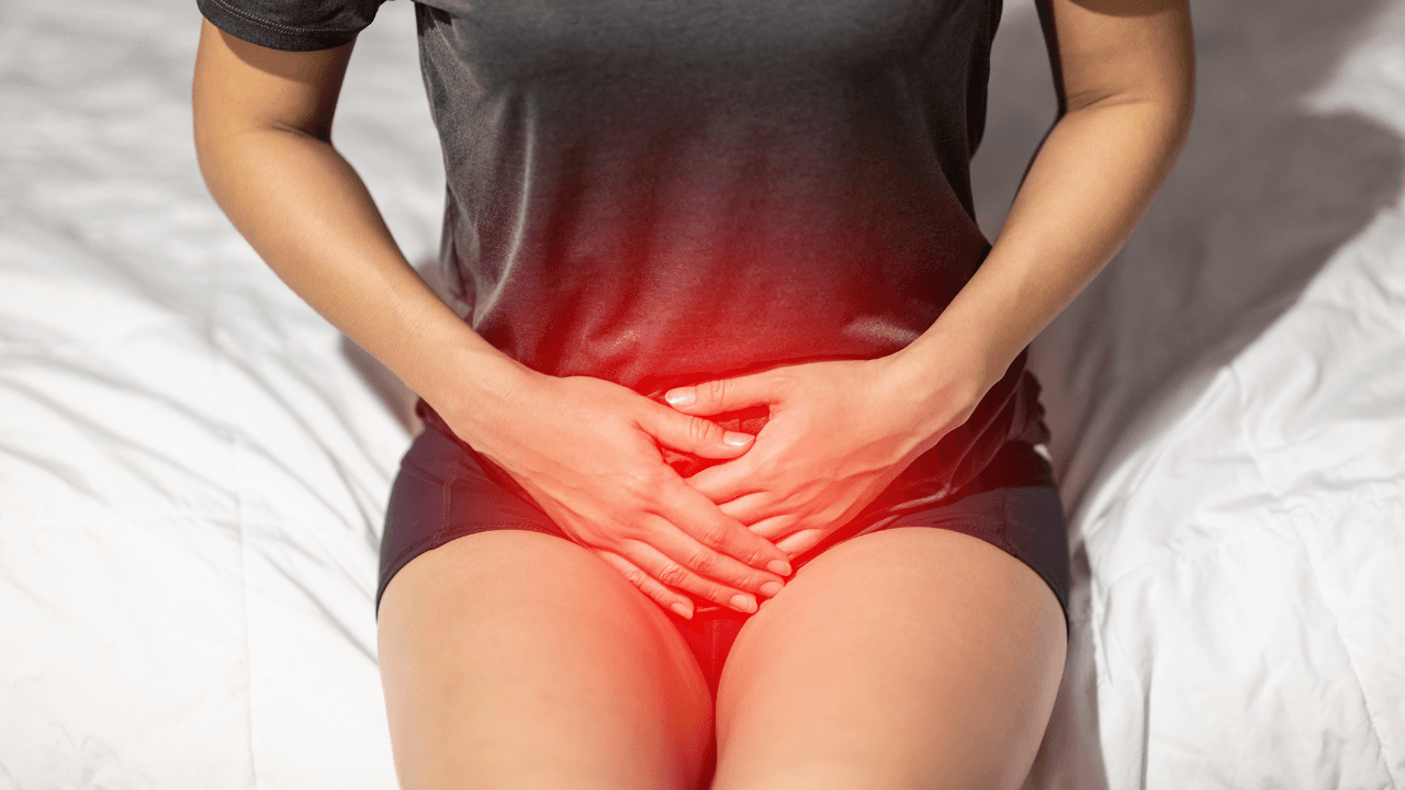 woman have bladder or uti pain sitting on bed in bedroom after wake up feeling so illness,Healthcare concept. Image Credit: Adobe Stock Images/220 Selfmade studio